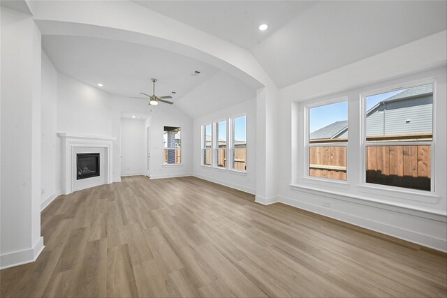 unfurnished bedroom with lofted ceiling and light carpet