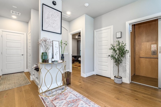 foyer entrance featuring hardwood / wood-style flooring