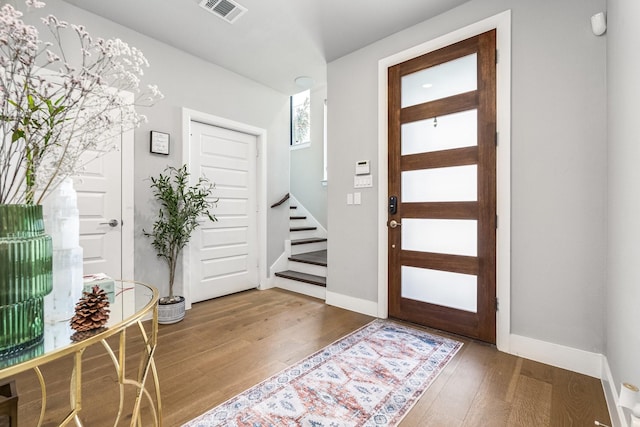 foyer entrance featuring wood-type flooring