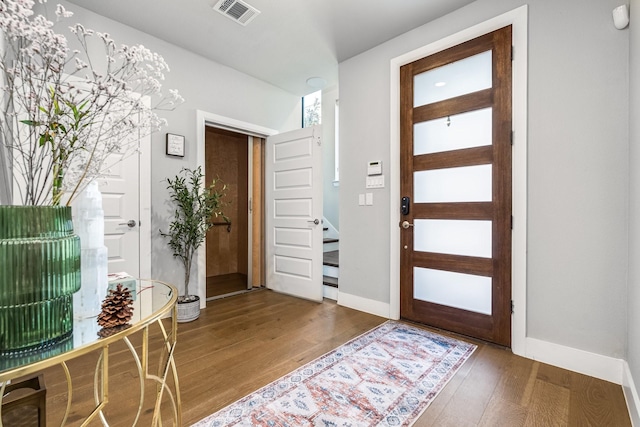 foyer entrance with wood-type flooring