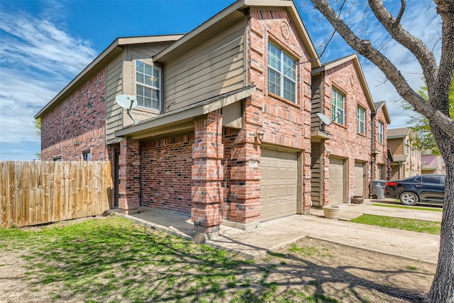 view of side of property featuring a garage