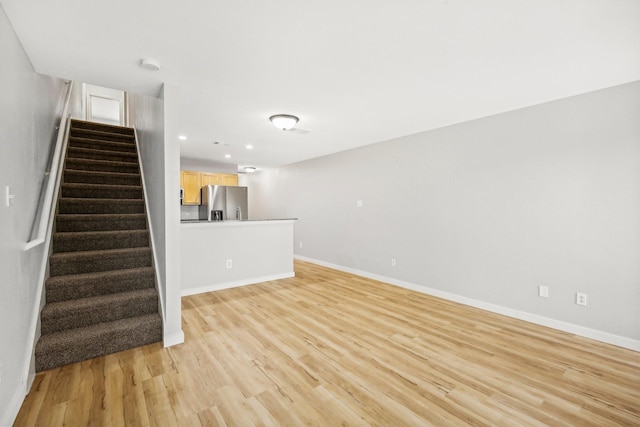 unfurnished living room featuring light hardwood / wood-style flooring