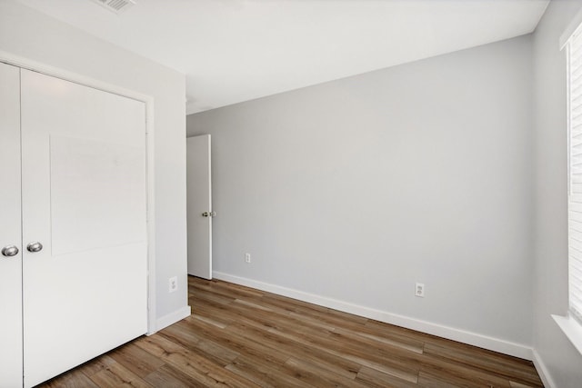 unfurnished bedroom featuring wood-type flooring