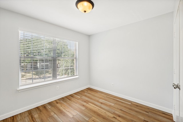 spare room featuring hardwood / wood-style flooring