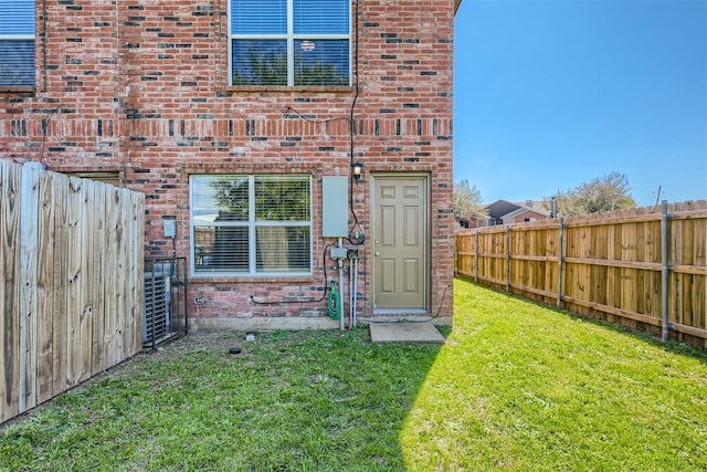 rear view of house featuring a yard