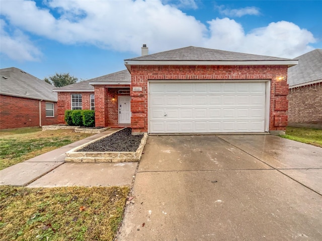 view of front of home with a front lawn and a garage