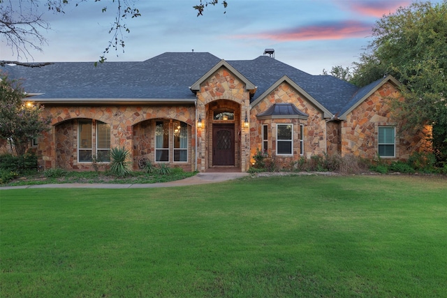 view of front of property with a yard