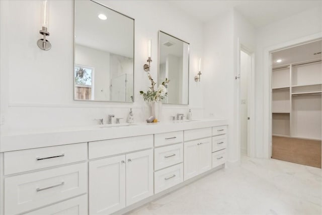 bathroom with vanity and walk in shower