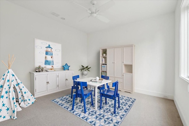 recreation room featuring ceiling fan and light carpet