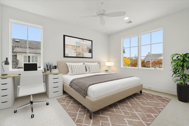 bedroom with ceiling fan and carpet floors