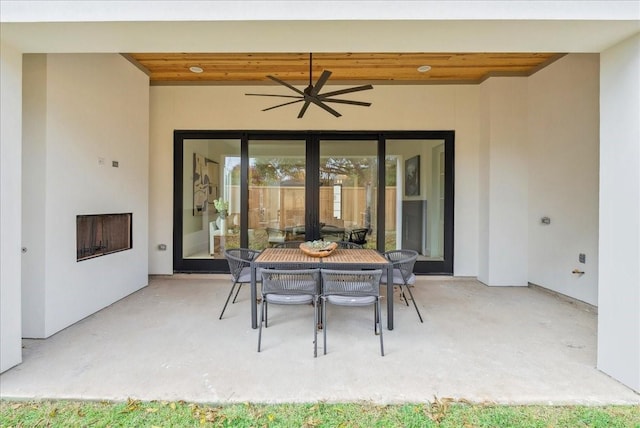 view of patio featuring ceiling fan