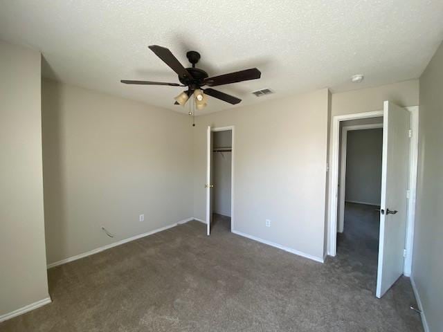 unfurnished bedroom featuring carpet flooring, a closet, baseboards, and visible vents