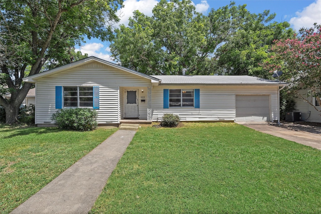 single story home featuring central AC, a front lawn, and a garage