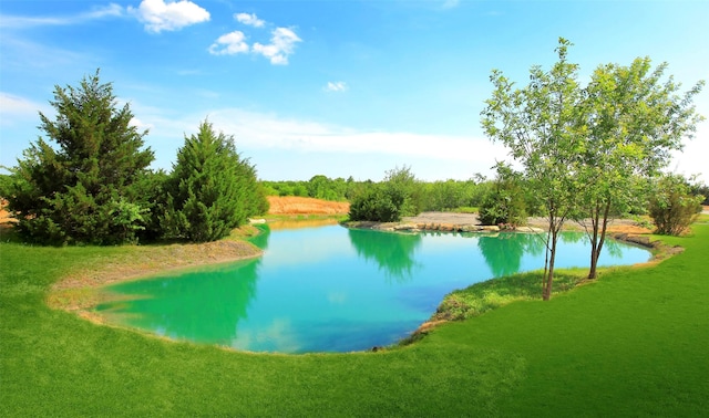 surrounding community featuring a yard and a water view