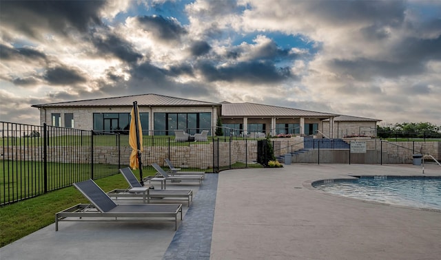 view of swimming pool with a patio area