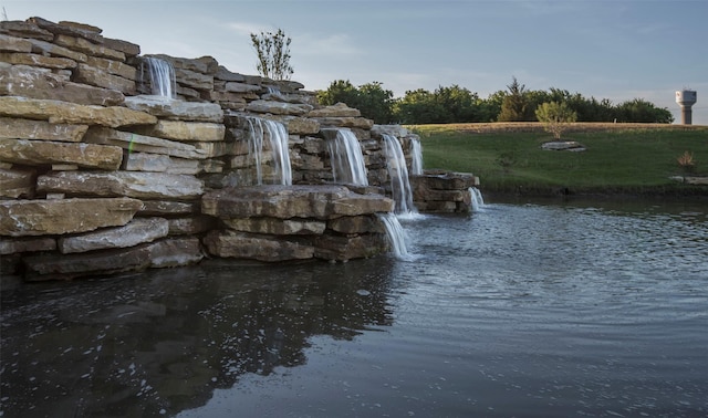 view of home's community with a water view