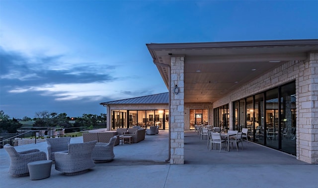 view of patio terrace at dusk