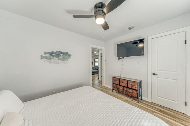 bedroom with ceiling fan and light wood-type flooring