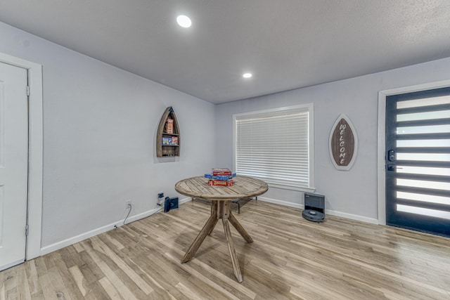 unfurnished dining area featuring light hardwood / wood-style floors