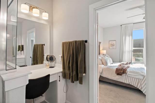 bathroom with ceiling fan and vanity