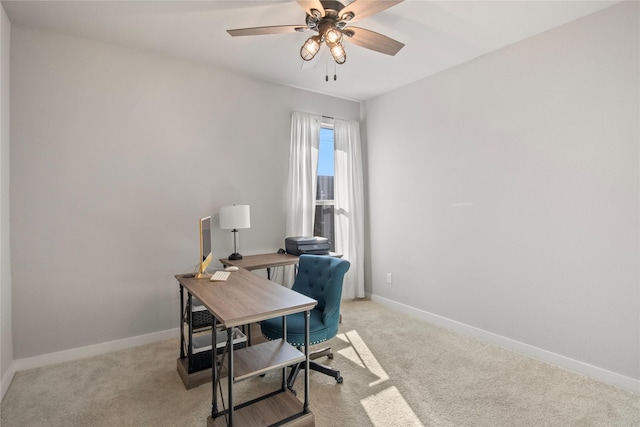 home office featuring ceiling fan and light colored carpet