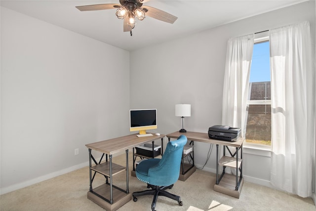 office featuring ceiling fan and light carpet