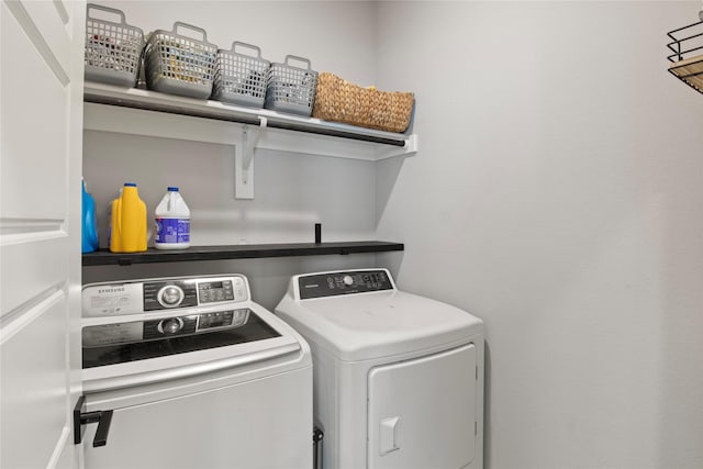 laundry room with independent washer and dryer