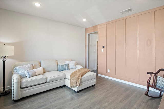 living room featuring dark hardwood / wood-style flooring