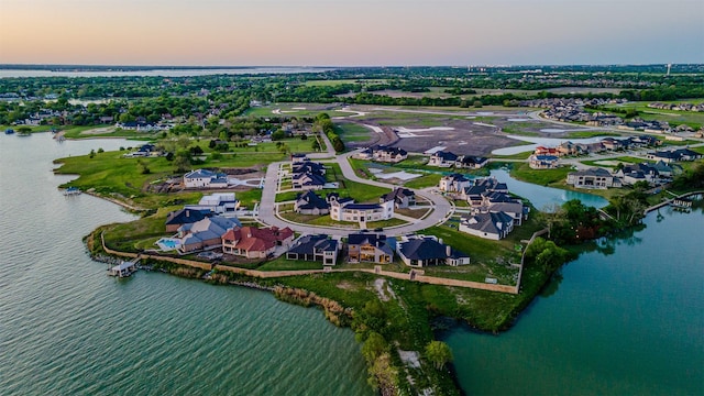 aerial view at dusk with a water view