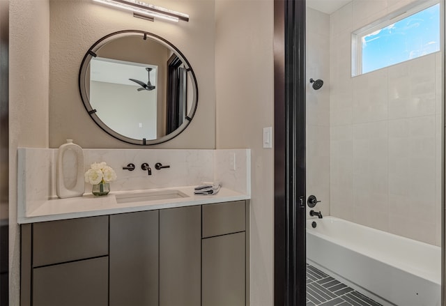 bathroom featuring vanity and tiled shower / bath combo