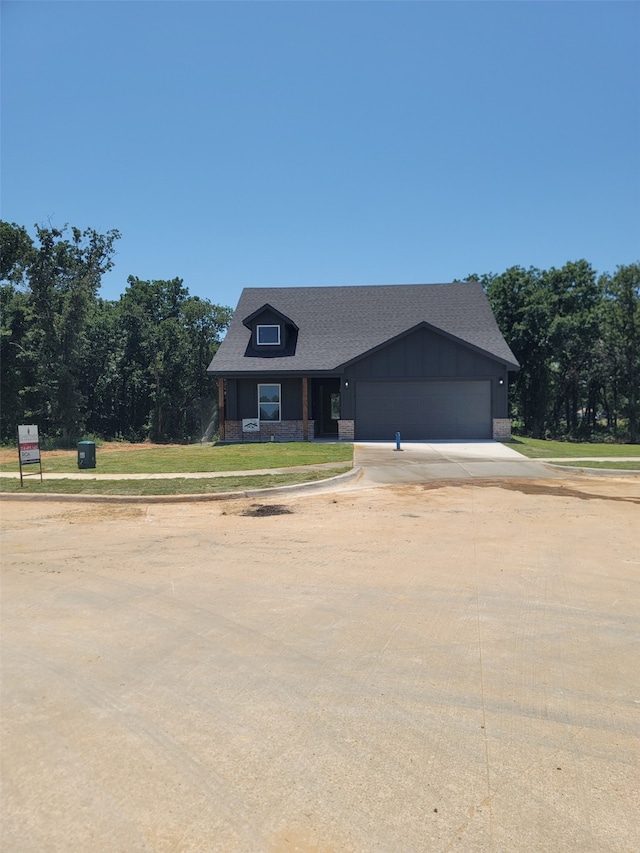 481 Peace Lily Way, Tolar, TX 76476 - view of front of house with driveway, a garage, a front lawn, roof with shingles, and board and batten siding