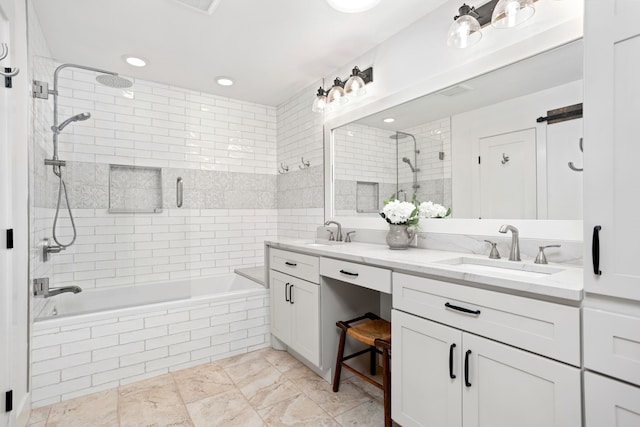 bathroom with vanity and tiled shower / bath