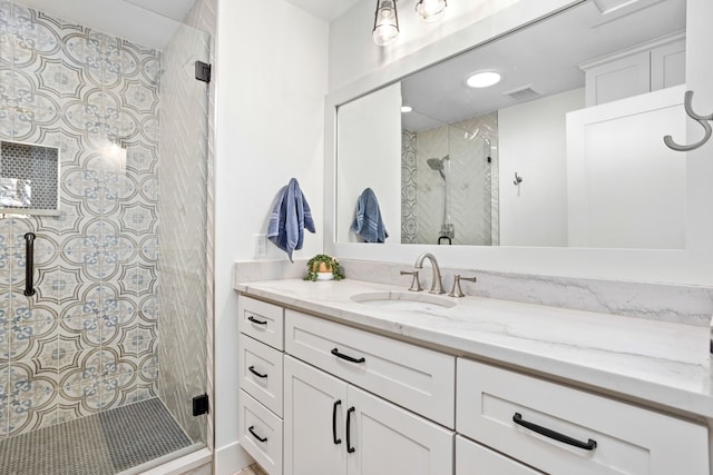 bathroom featuring vanity and walk in shower