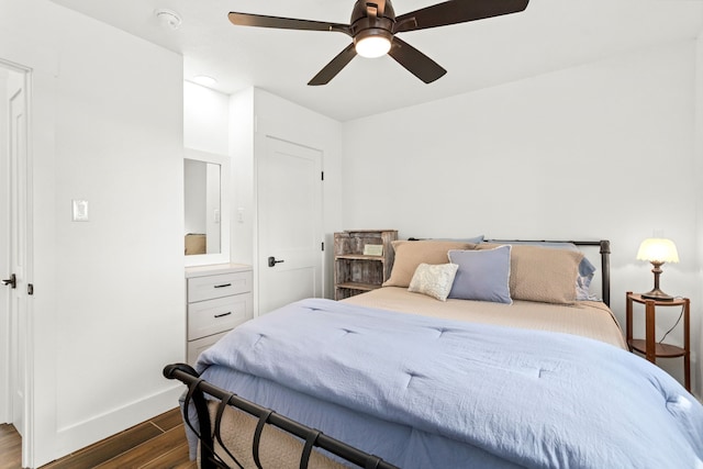 bedroom featuring ceiling fan and dark hardwood / wood-style flooring