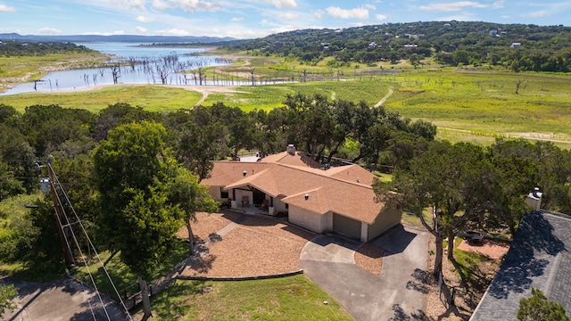 birds eye view of property with a rural view and a water view