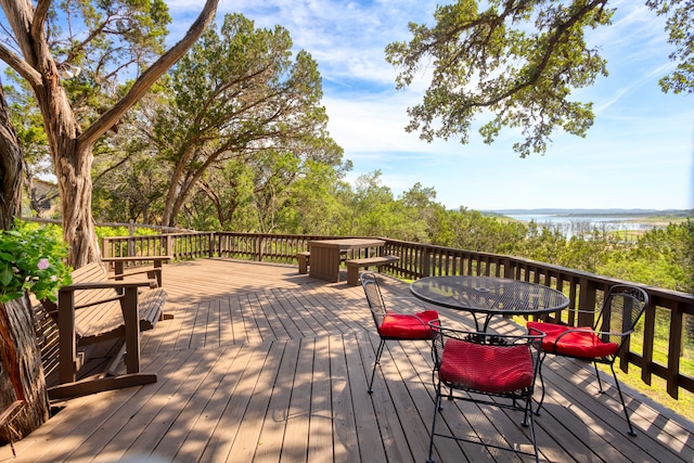 wooden terrace with a water view