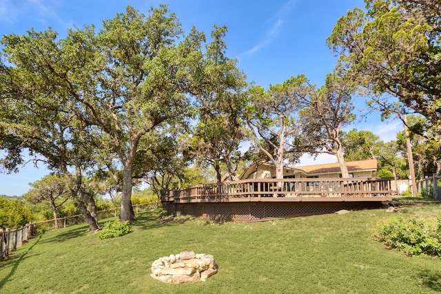 view of yard with a fire pit and a wooden deck