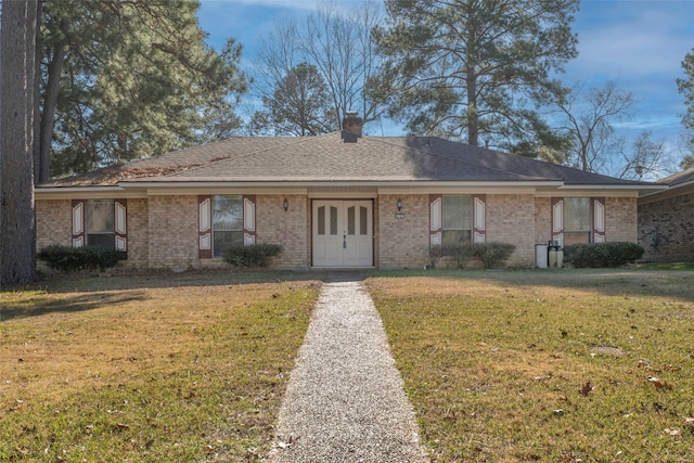 single story home with a front yard