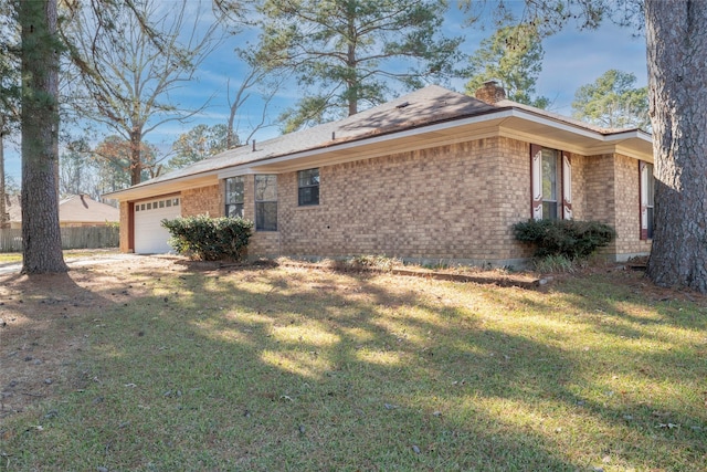 exterior space with a front yard and a garage