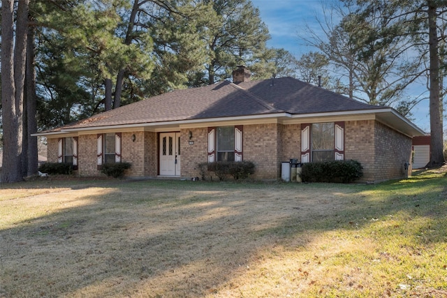 ranch-style home featuring a front yard