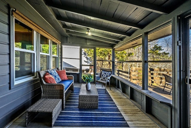 sunroom with wood ceiling and lofted ceiling with beams