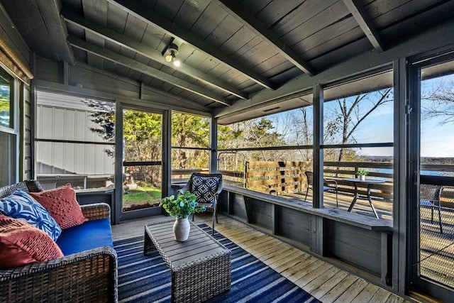 sunroom / solarium with vaulted ceiling with beams and wood ceiling