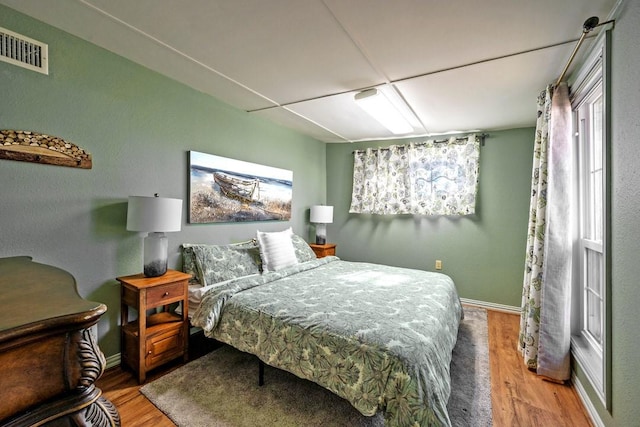 bedroom featuring wood-type flooring