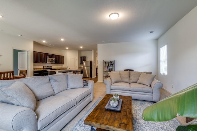 living room with light carpet