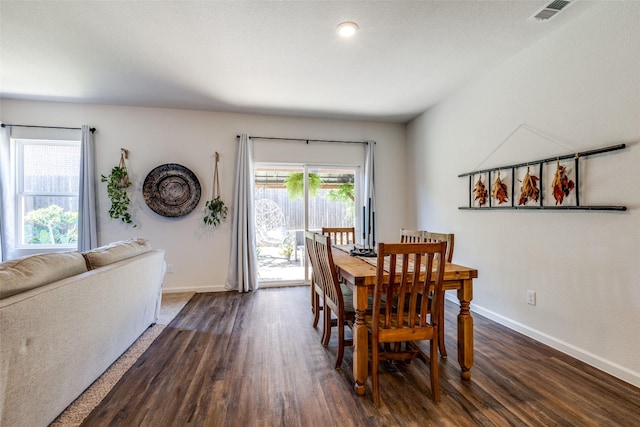 dining area with dark hardwood / wood-style flooring