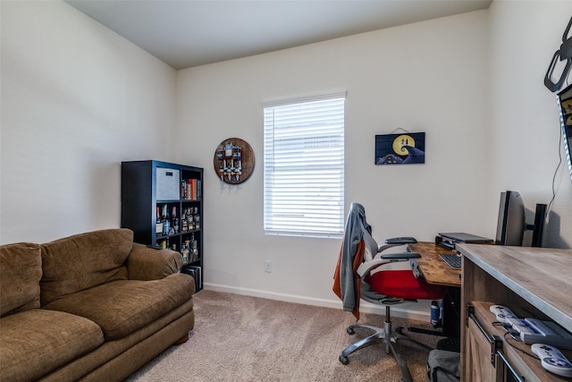 home office featuring light carpet and a healthy amount of sunlight