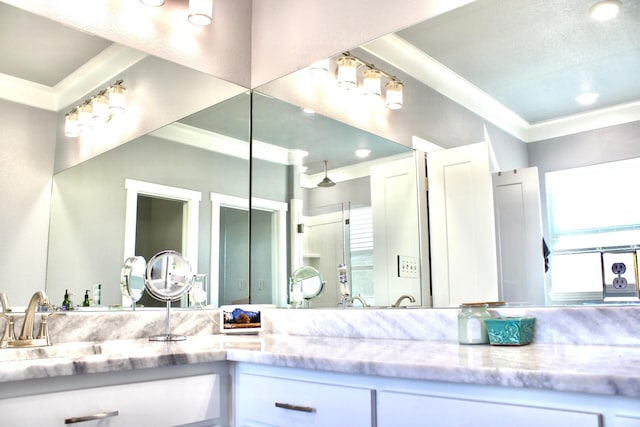 full bathroom with vanity, ornamental molding, and an enclosed shower