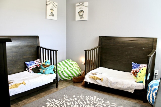 bedroom with wood-type flooring