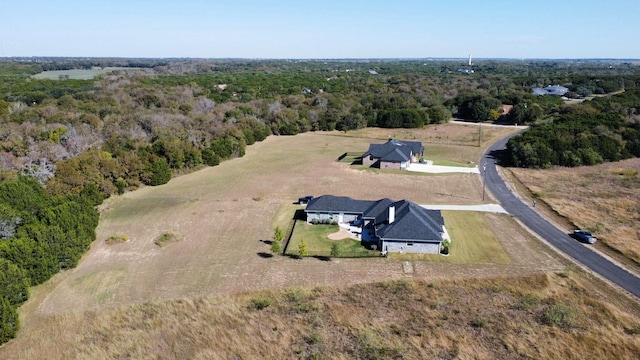 birds eye view of property with a rural view