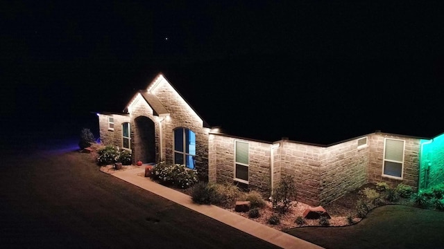 view of property exterior at night